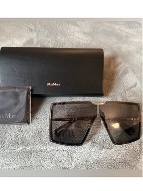 MaxMara Shield Sunglasses in black with grey gradient lenses. Gold hardware